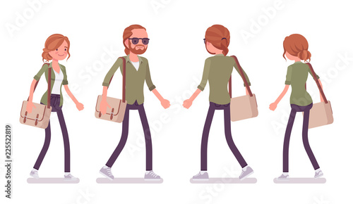 Young red-haired man and woman walking
