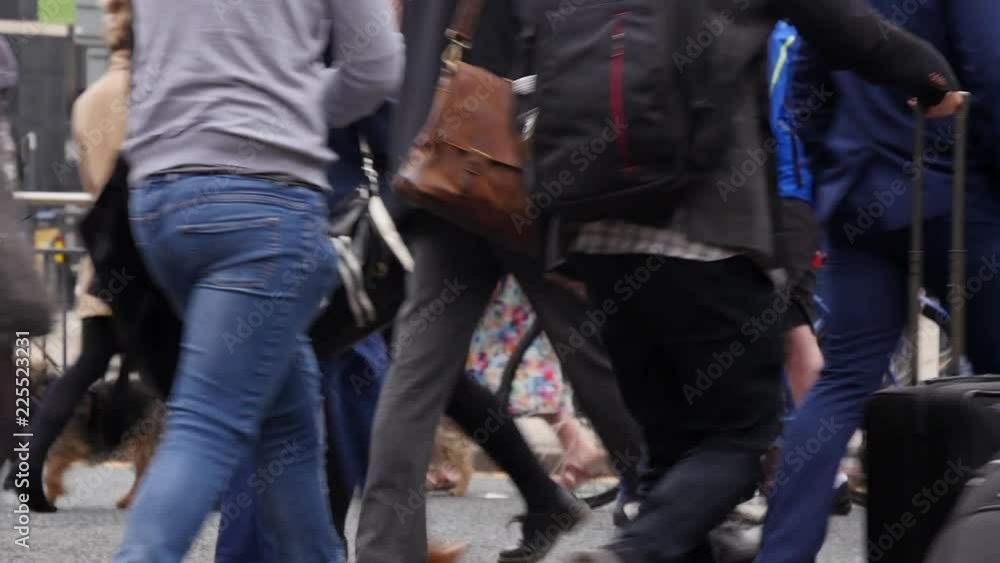 Pedestrians crossing at a busy intersection Pedestrians crossing at a busy intersection