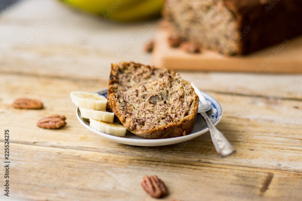 Slice of homemade banana bread on a white plate