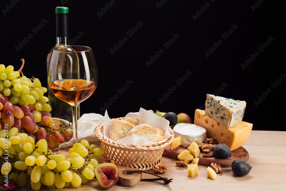 Wine and cheese on the table