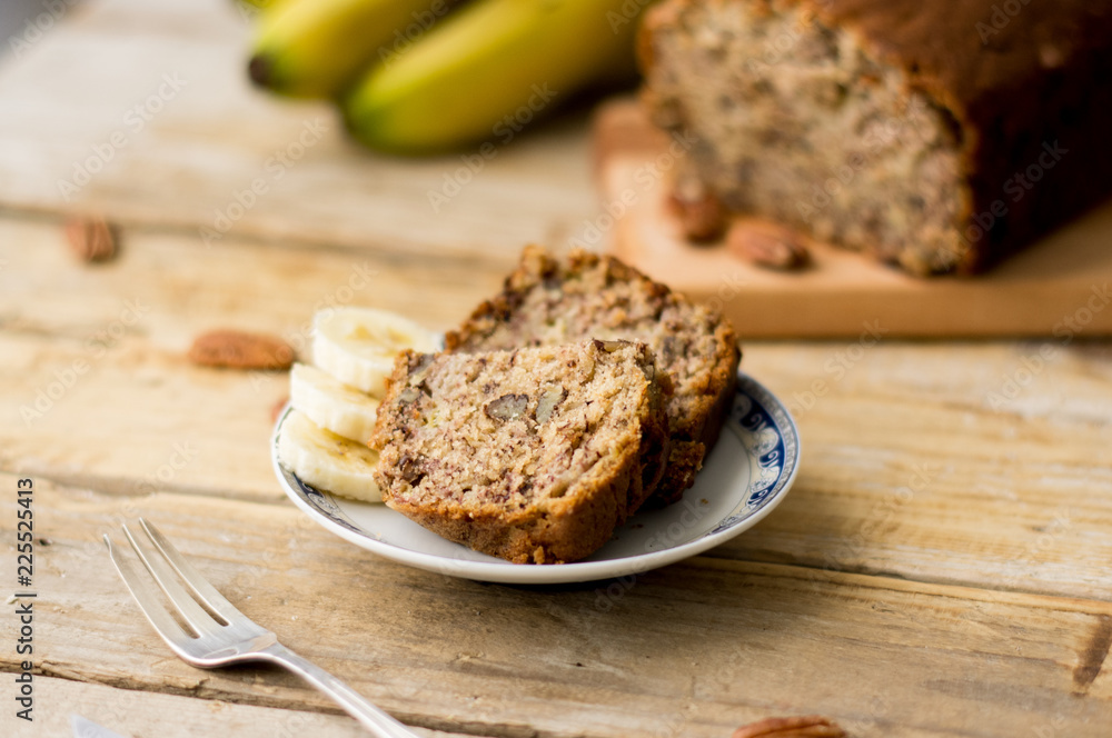 Slice of homemade banana bread on a white plate