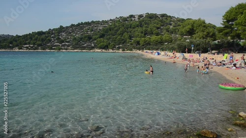 Island Murter, Croatia, 14th September 2018, People are sunbathing and swimming. Tourists are enjoying and having fun on the beach. Croatian coast, bay and beaches. Adriatic Sea at Summer. Beaches and