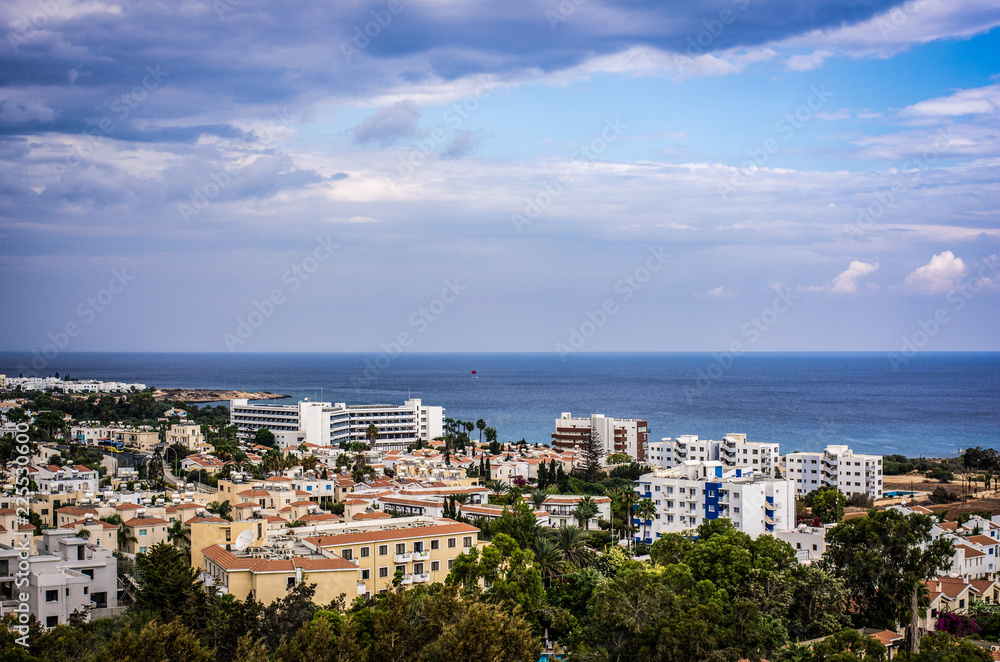 Scenic landscape of houses on the background of a calm blue sea horizon