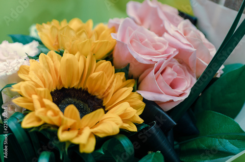 flowers composition for holiday celebration. beautiful bouquet with roses and sunflowers 