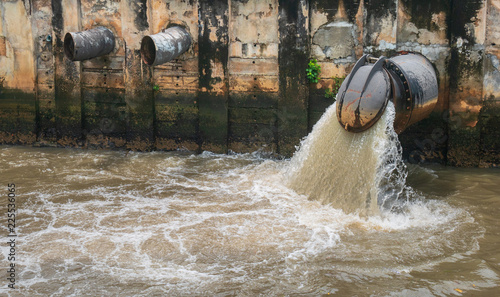 Wallpaper Mural The large drain of the city is draining the wastewater into the canal, flowing into the sea, as a result of environmental issues in environment and ecology concept. Torontodigital.ca