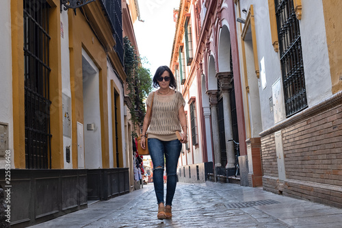 Woman walking through the streets of Seville