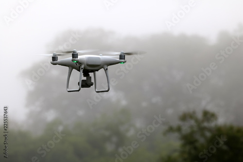 Drone Camera flying in the sky while the rain forests background