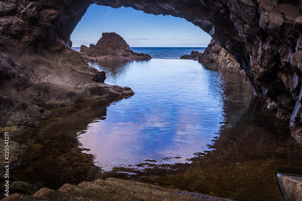 Seixal, Madeira/Portugal. Natural pool in front of the volcanic cliffs of Seixal on the Atlantic Ocean