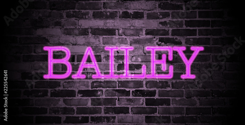 first name Bailey in pink neon on brick wall