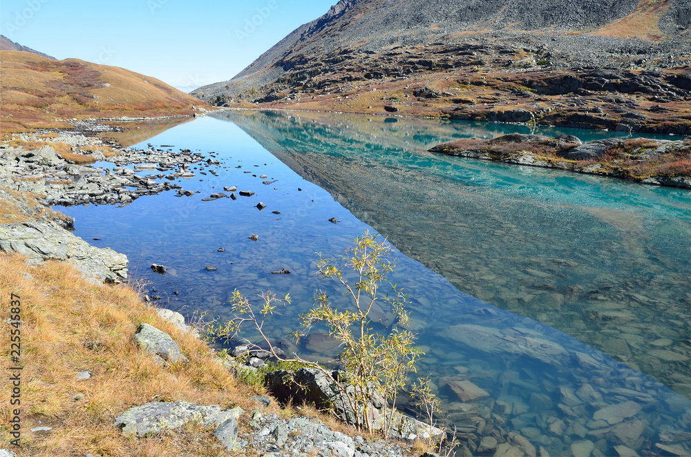 Russia, Altai mountains, lake Acchan (Akchan) in autumn in sunny weather