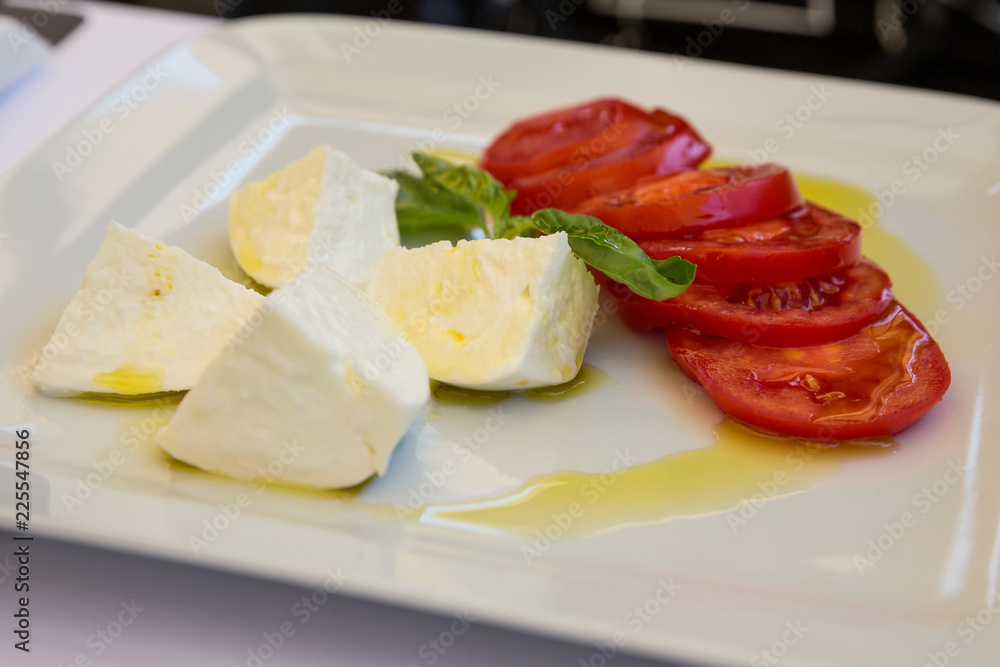Buffalo mozzarella, tomato and basil salad dressed with extra virgin olive oil. Buffalo mozzarella, tomato and basil salad dressed with extra virgin olive oil.