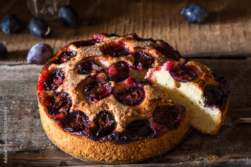 Homemade plum pie on the old wooden background. Still life of food. plum tart. Autumn harvest. Old fashion cuisine. Portion of pie. Plum bakery. Rustic open pie. Winter pie. New York pie. Homemade plum pie on the old wooden background. Still life of food. plum tart. Autumn harvest. Old fashion cuisine. Portion of pie. Plum bakery. Rustic open pie. Winter pie. New York pie.