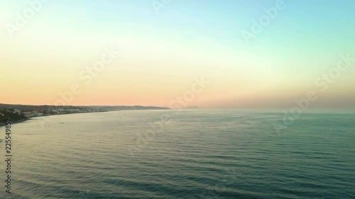 AERIAL SHOT MOVING FORWARD. Bay area of Gibraltar on left with calm empty ocean on the left.