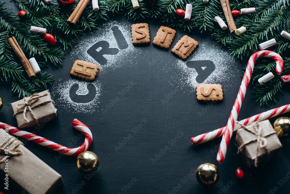 Christmas background with festive decoration on dark background. Winter Flat Lay Christmas background with festive decoration on dark background. Winter Flat Lay