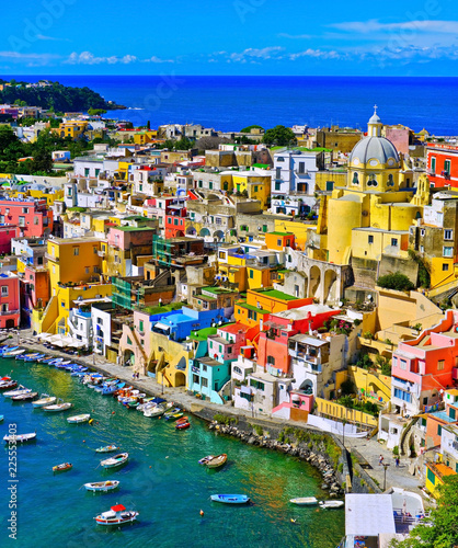 View of the Port of Corricella with lots of colorful houses on a sunny day in Procida Island, Italy. photo