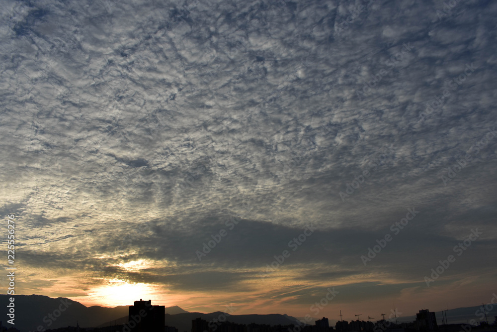 Morning sky over the roofs. Sunrise. Urban landscape. Dawn. Daybreak. Sunset Morning sky over the roofs. Sunrise. Urban landscape. Dawn. Daybreak. Sunset