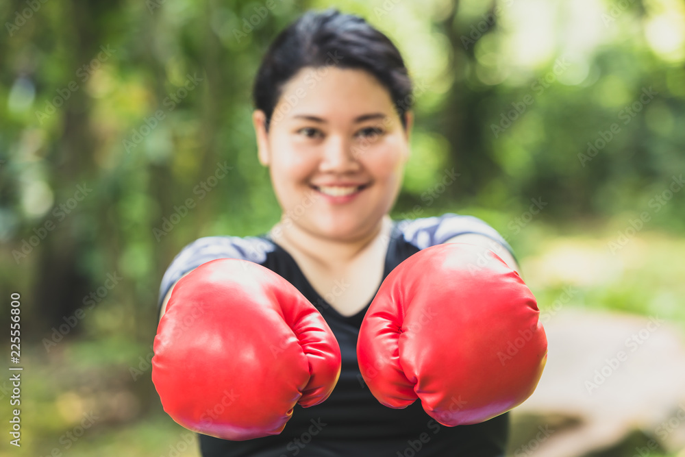 Fat girl happy and smile boxing fight for good healthy and diet concept. Fat girl happy and smile boxing fight for good healthy and diet concept.
