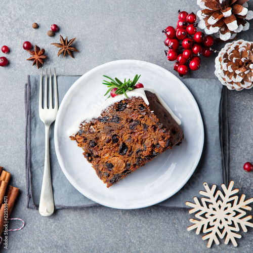 Christmas fruit cake, pudding on white plate. Copy space. Top view. photo