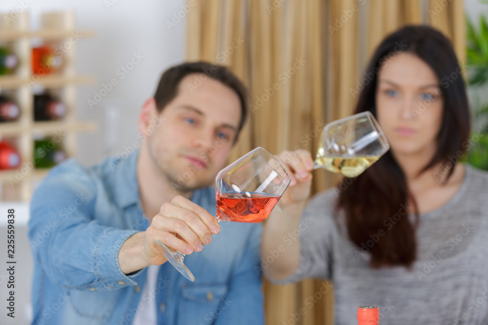 couple enjoying and drinking wine at tasting