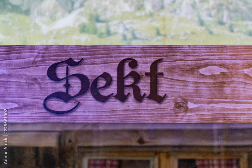 wooden signs from at the german oktoberfest referring to champagne-sekt area where people can buy alcohol