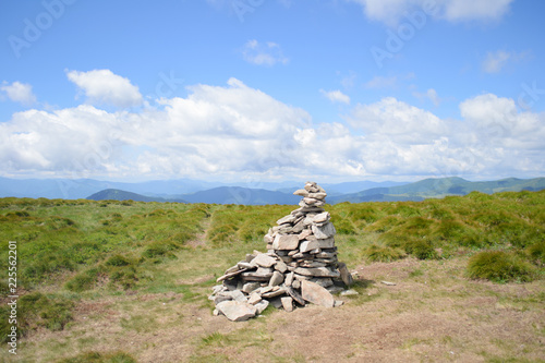 a hill of  stones on top of a mountain