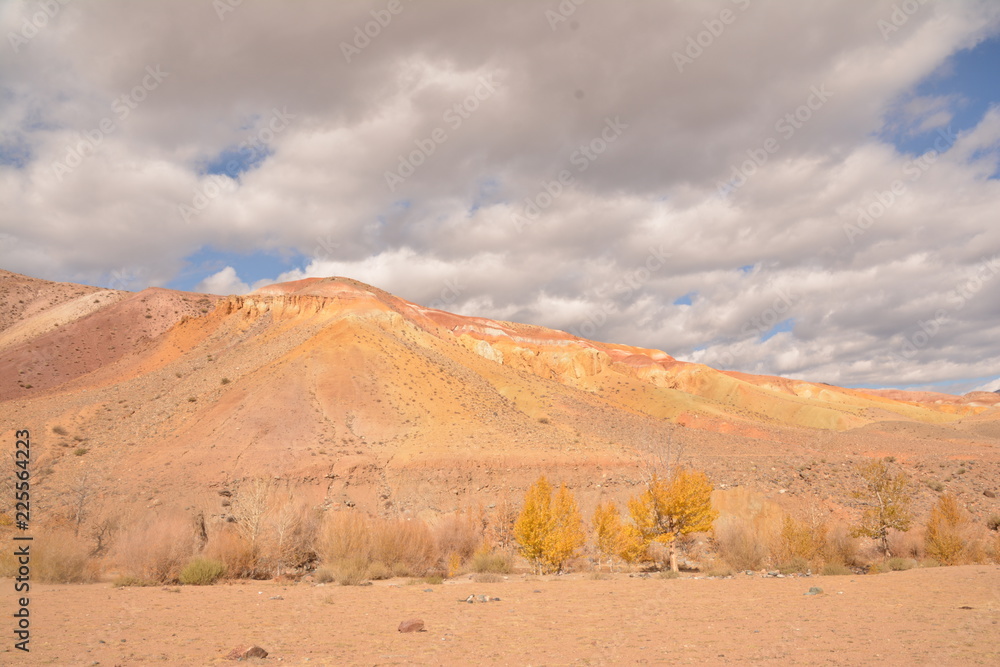 Fototapeta premium mountains landscape nature landscape view sky air oxygen autumn season grass trees blue yellow sand stone gray brown ridge water river rocks rock blue Altai,Russia open space