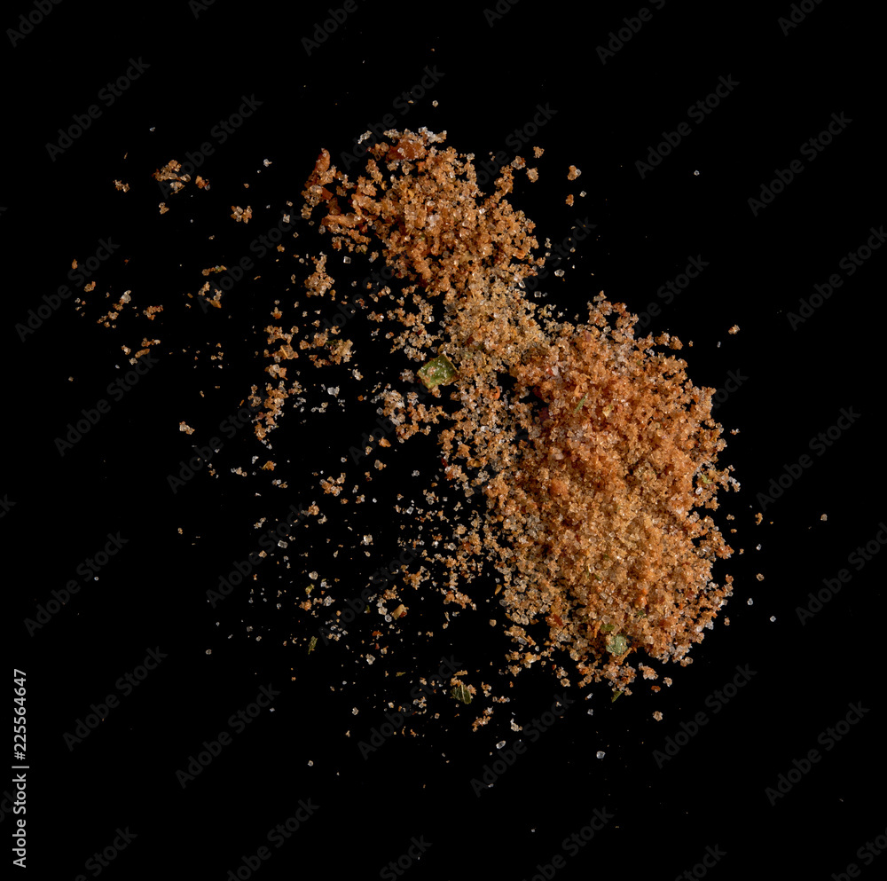 Chilli pepper spices seasoning for soup with vegetables on black background Chilli pepper spices seasoning for soup with vegetables on black background