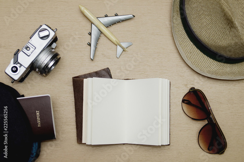 Travel objects flat lay on wooden table, Vacation concept