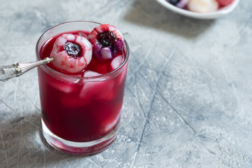 Red halloween cocktail with eye