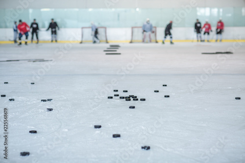 ice hockey training, pucks and players