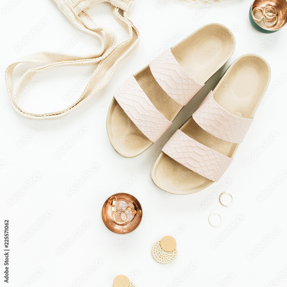 Woman accessories: slippers, string bag, earring and rings on white background. Flat lay, top view fashion accessories. Woman accessories: slippers, string bag, earring and rings on white background. Flat lay, top view fashion accessories.