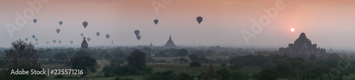 Hot air balloon over plain of Bagan in misty morning, Myanmar