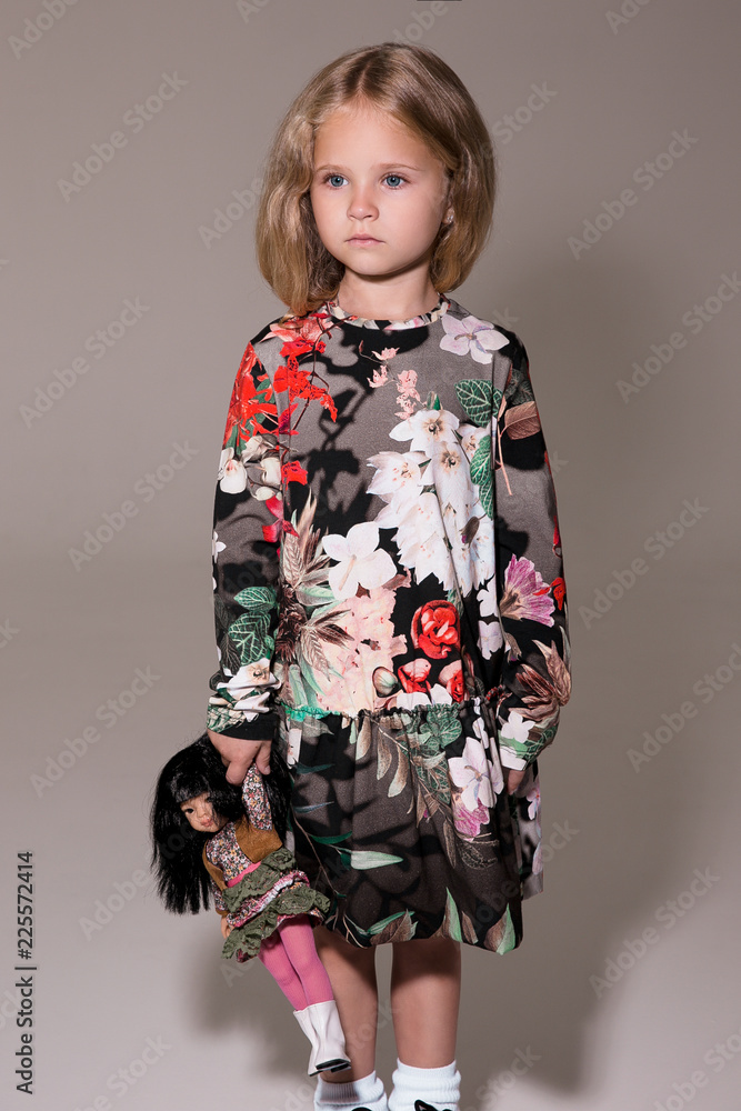 Young fashion model in a studio, fashion portrait, child portrait Young fashion model in a studio, fashion portrait, child portrait
