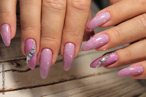 glamorous manicure of nails on beautiful female hands