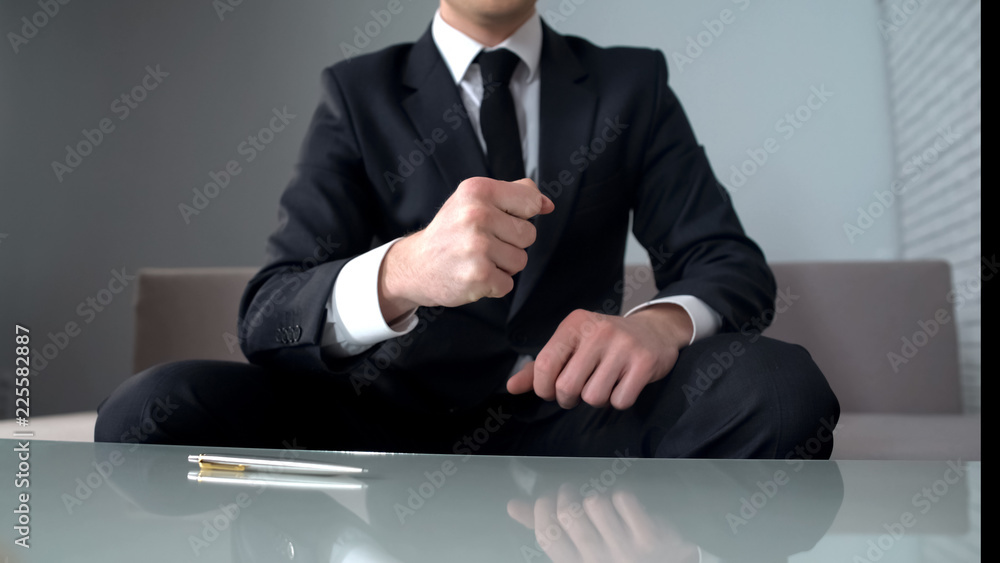 Motivated businessman clenching fists, confident of successful startup, winner Motivated businessman clenching fists, confident of successful startup, winner