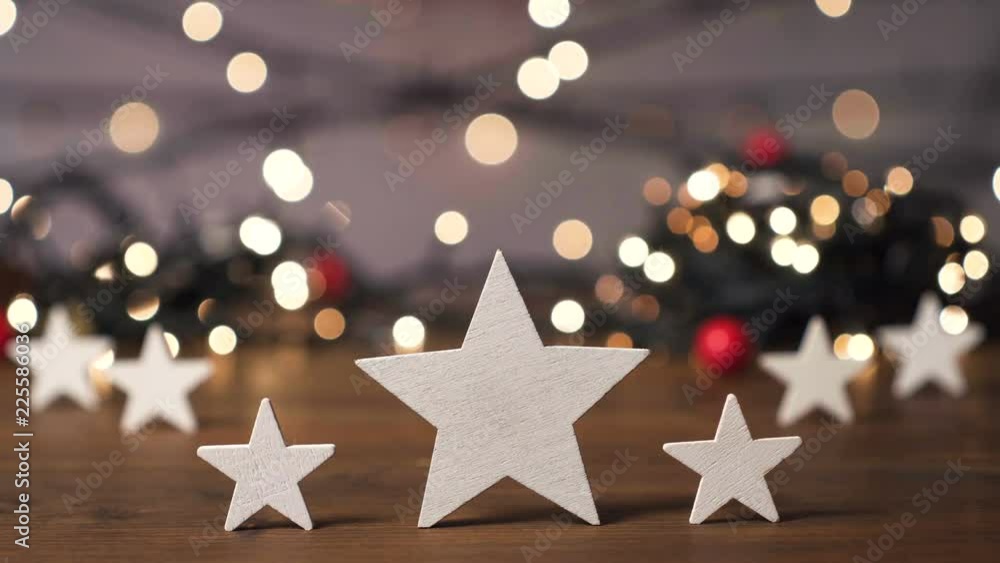 Christmas background, stars on wooden table Christmas background, stars on wooden table