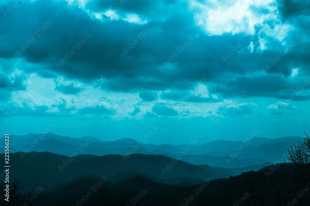 VIEW OF LAYERS OF MOUNTAIN AND DARK CLOUD IN BLUE RIDGE PARK WAY, NORTH CAROLINA, USA