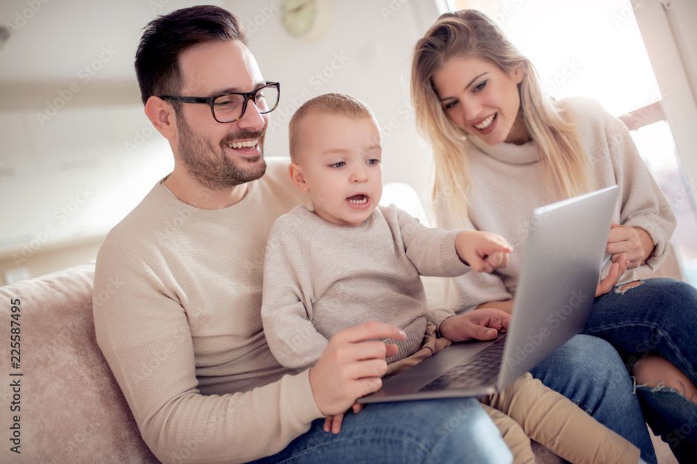 Happy family using laptop