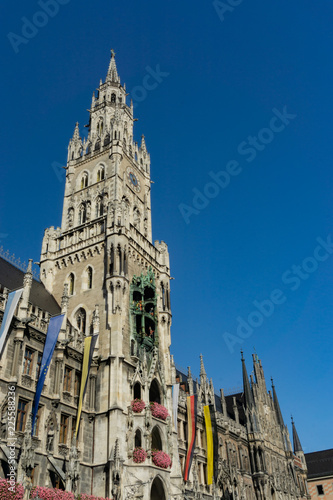 The clock tower of the new City Hall (Rathaus) in Marienplatz is a famous building in Gothic architecture - Munich, Bavaria, Germany, Europe