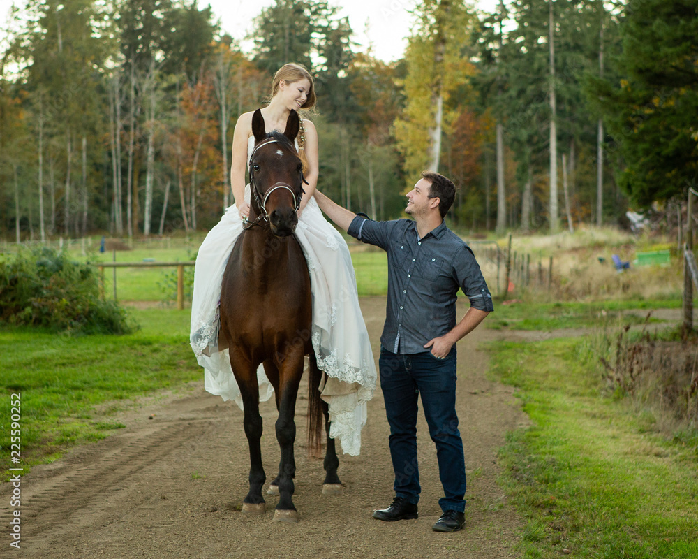 Young couple in the country with horse Young couple in the country with horse