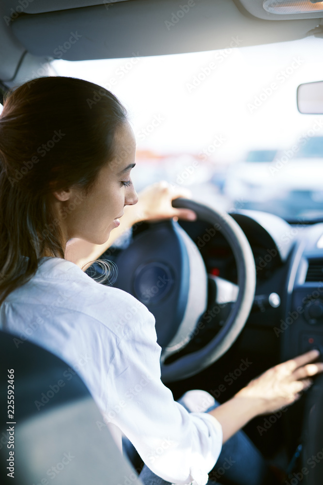 back view a woman driver in the car back view a woman driver in the car