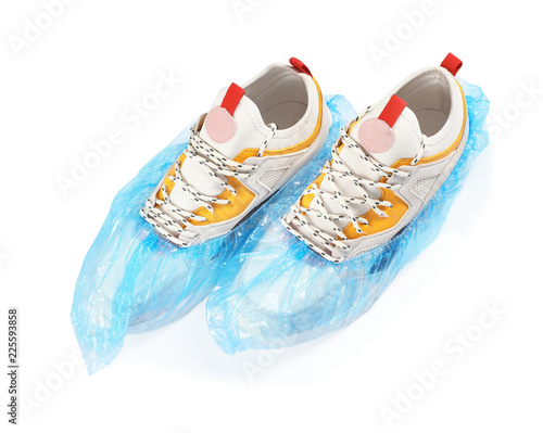 Pair of sneakers in medical blue covers on white background