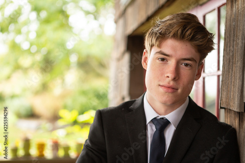 Attractive teenage boy wearing suit