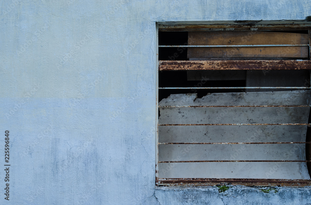 Half a window of a blue house. sidewalk. Half a window of a blue house. sidewalk.