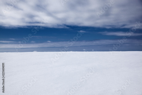 winter background of fresh snow and blue sky