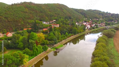 Camera flight over The Berounka river near Zbecno. Beautiful natural park in Czech Republic. European landmarks from above. photo