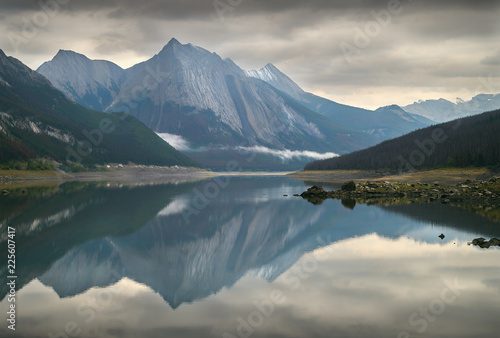 Medicine Lake, Alberta. Medicine Lake reflection of fresh snow on the surrounding peaks. Alberta, Canada.