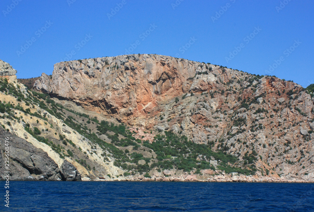 Sea waves, surf. Rocks and rocks. Black Sea. Summer. Side view