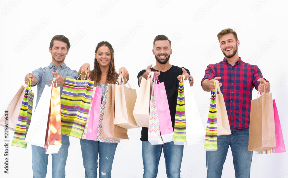 Obraz premium young people showing their colorful shopping bags