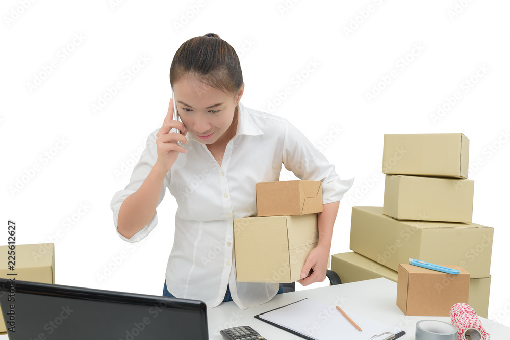 teenager owner business woman work at home with smartphone, laptop for online shopping writing the order teenager owner business woman work at home with smartphone, laptop for online shopping writing the order